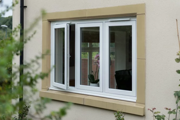 White flush sash uPVC window with one opening casement, set in a rendered wall in Chichester.