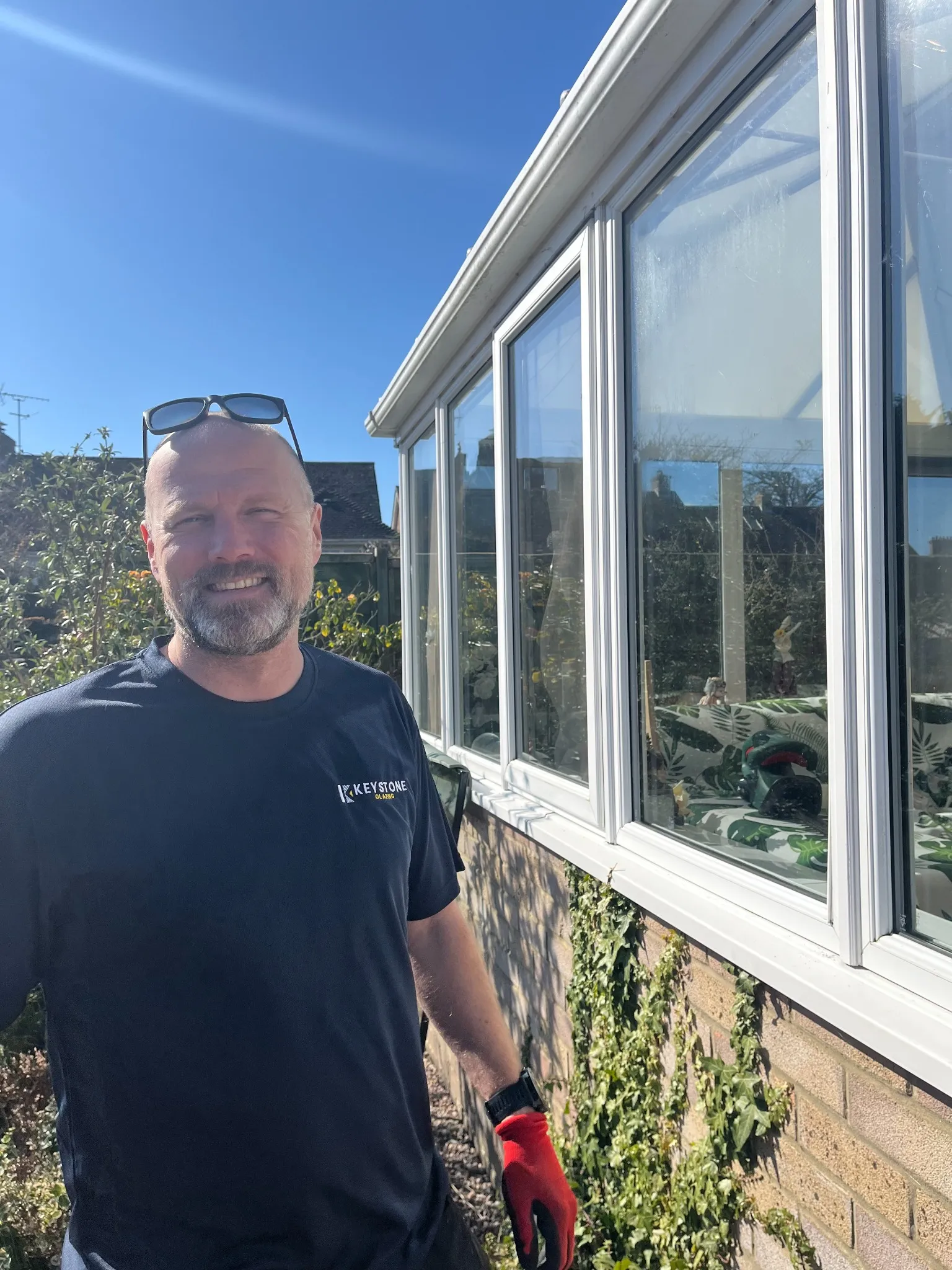 A member of the Keystone Glazing team outside a newly glazed conservatory