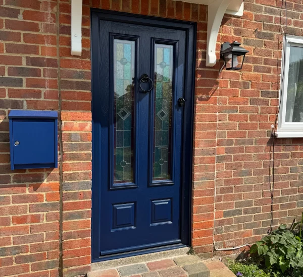 Endurance composite front door in French Navy with decorative glass panels, installed by Keystone Glazing in Waterlooville.