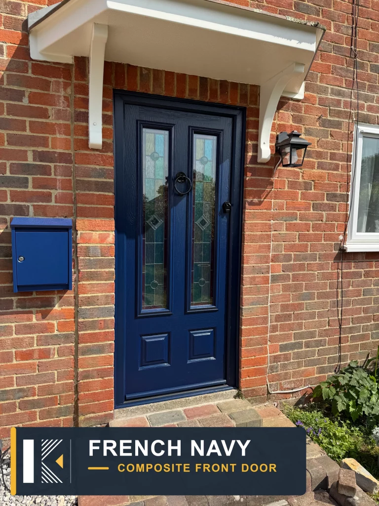French navy composite front door with decorative glazed panels in a red brick entrance, Waterlooville
